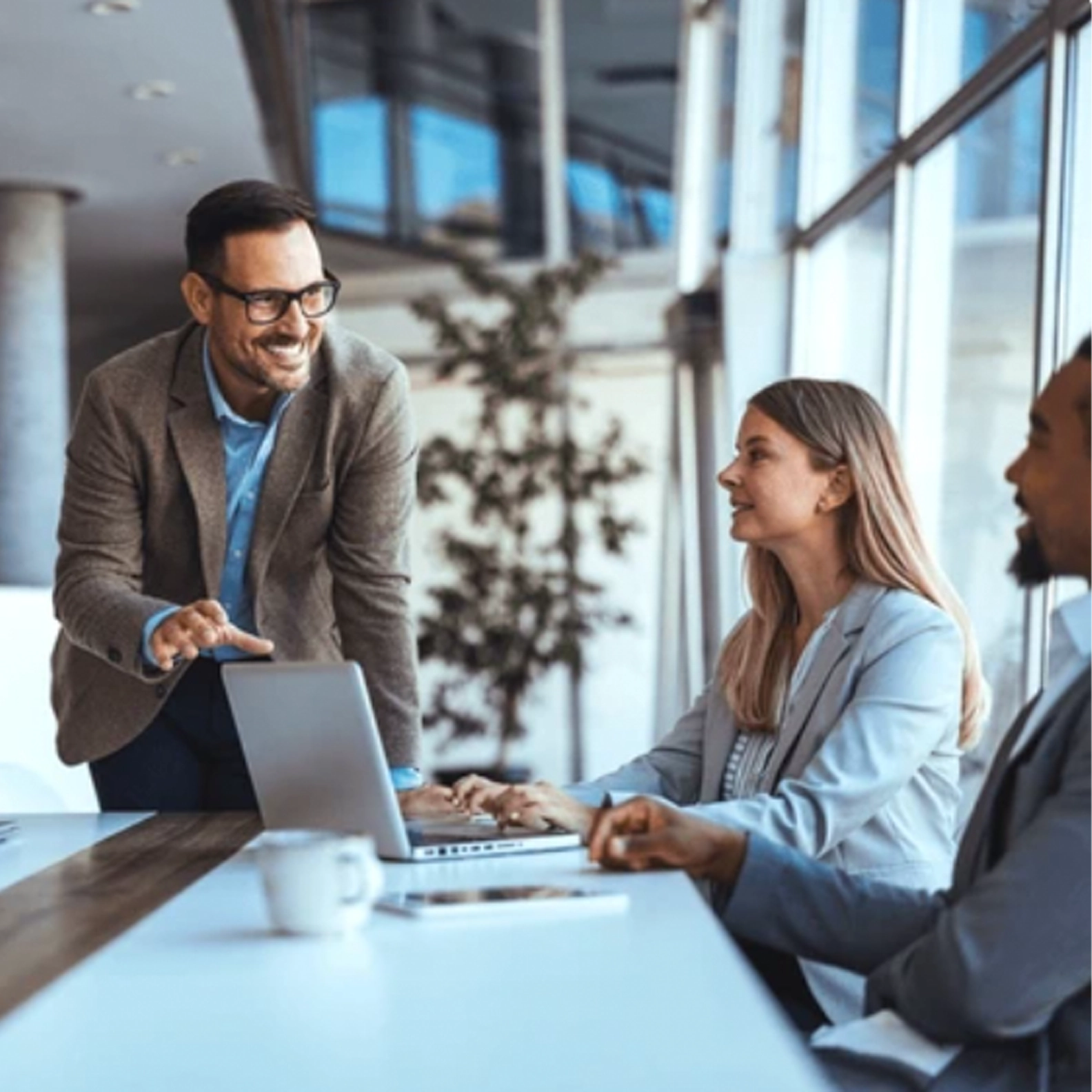Man speaking to table of people